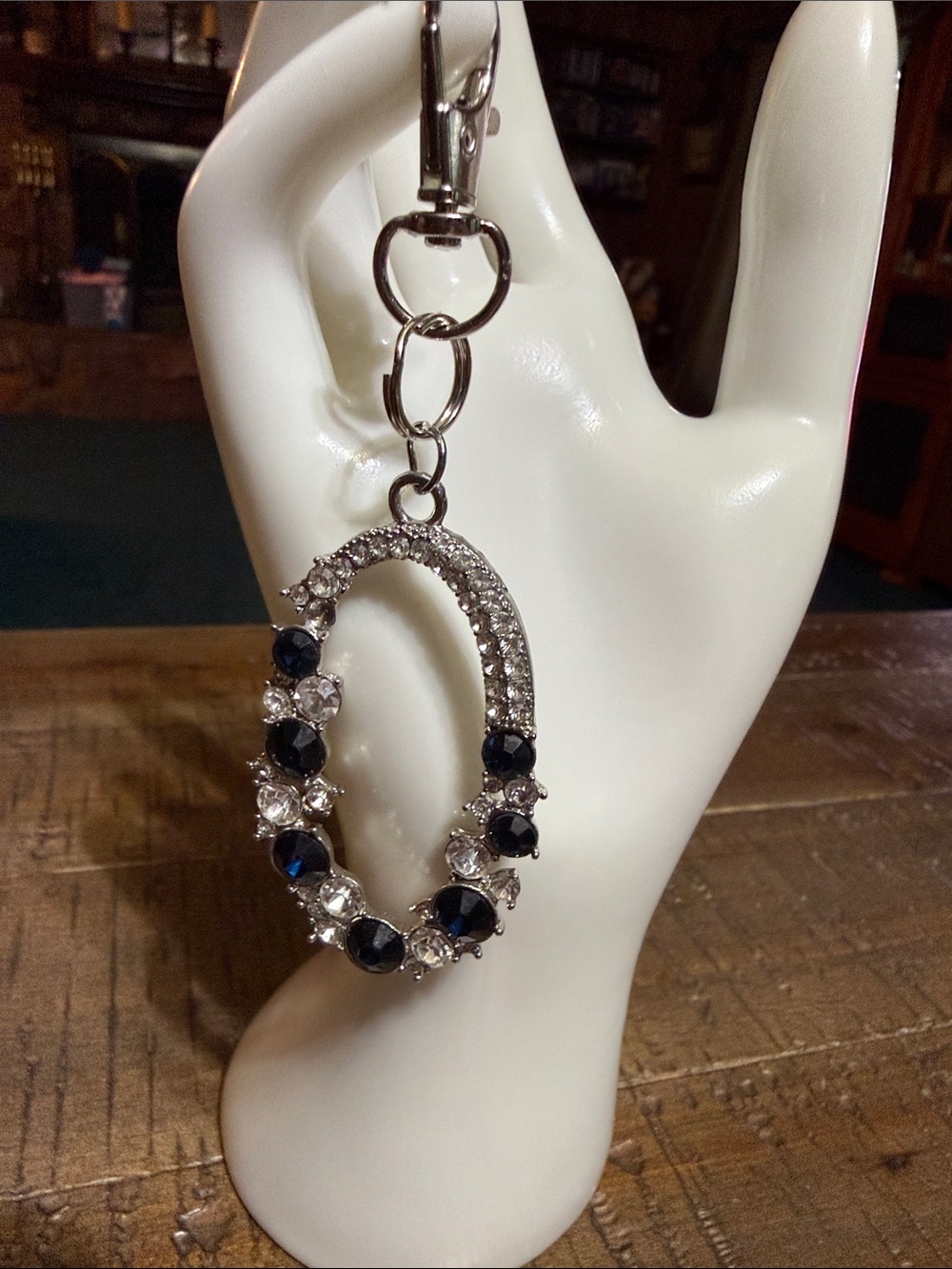 Silver-tone Oval Keychain with Navy Blue and Clear Stones